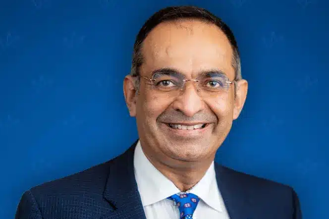 Paresh Raja, Founder and CEO of MFS Bridging, smiling at the camera.